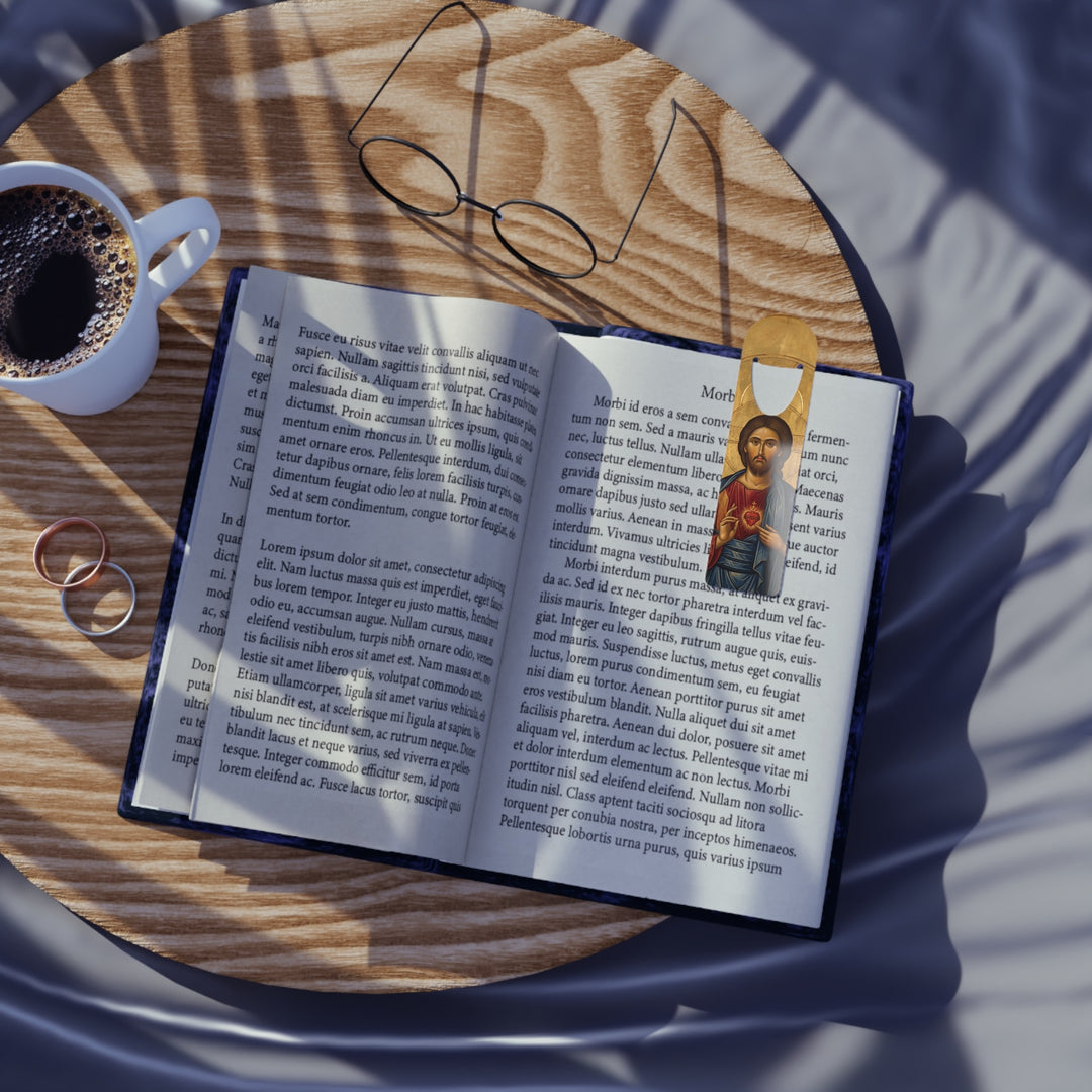 Sacred Heart of Jesus bookmark marking a page in an open book